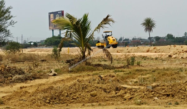 Row of assorted excavated soil and gravel mounds staged on the Sobha One Residences construction site