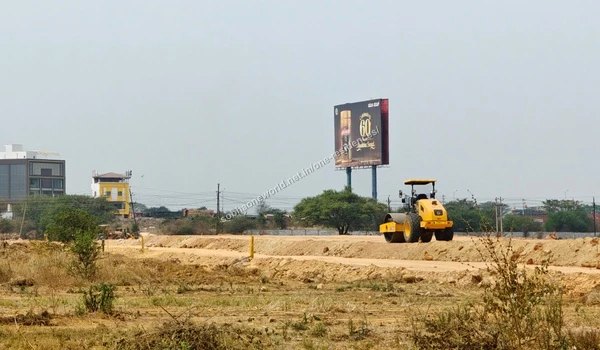 Earth levelling along the boundary lines with existing palm trees at the Sobha One Residences property