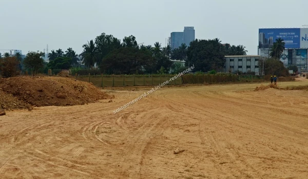 Active earth stabilization and leveling progress on the raised internal dirt pathways of Sobha One Residences