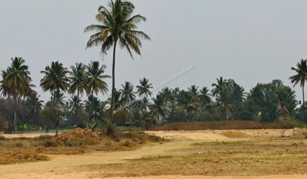 Uneven graded terrain at the Sobha One Residences location showcasing the distant city skyline and urban boundary