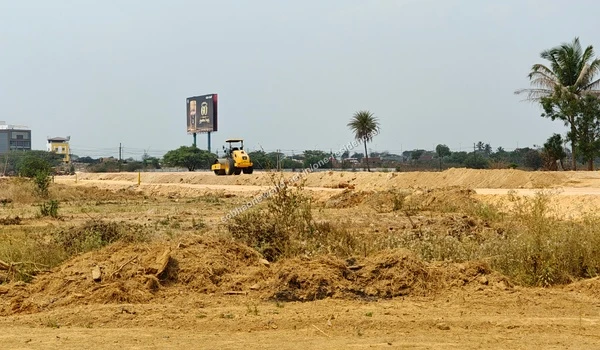 Multiple heaps of excavated soil staged on the graded grounds of the Sobha One Residences site