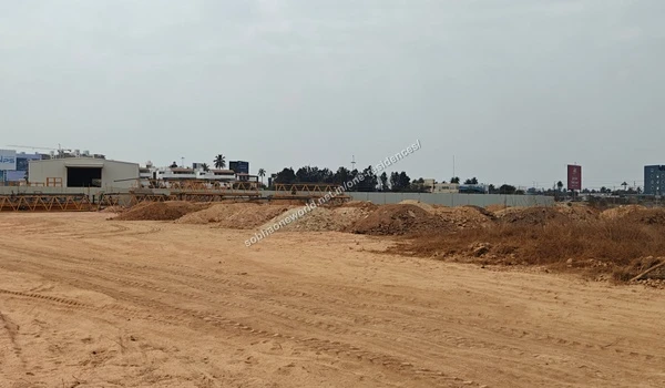 Stockpiled earth materials staged for ground levelling across the Sobha One Residences plot