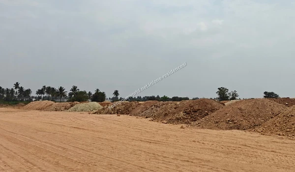 Mounds of excavated soil piled across the construction site of Sobha One Residences