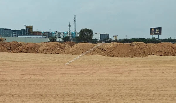 Mounds of staged earth materials gathered along the boundary of the Sobha One Residences development