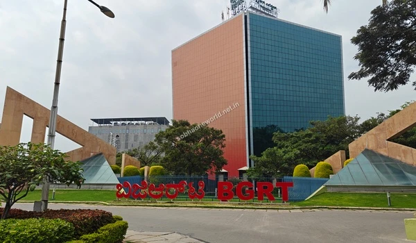 Grand entrance of the Bearys Global Research Triangle featuring distinct triangular architecture close to Sobha One World