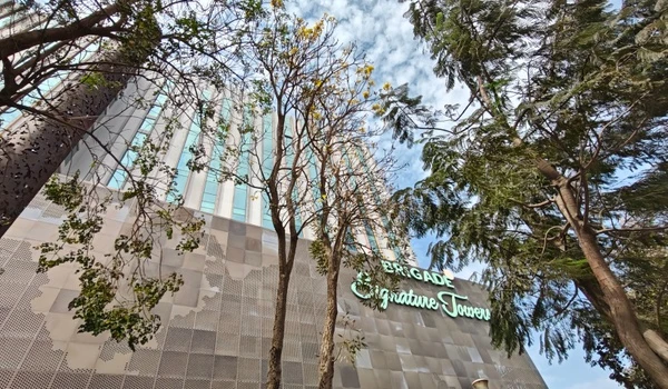 Scenic view of the business district buildings towering over lush greenery ensuring a perfect work life balance at Sobha One World