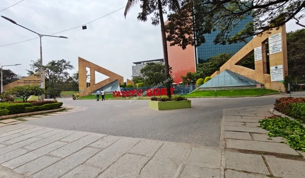 Impressive modern architecture of nearby business parks featuring tall decorative pillars and glass facades close to Sobha One World