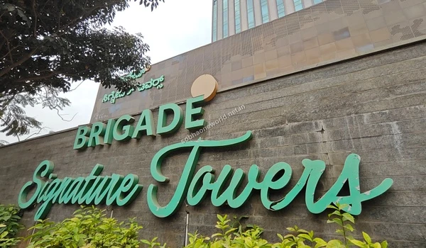 Smooth urban commute routes lined with lush trees and impressive office towers near the Sobha One World location