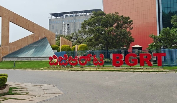Grand entrance to the bustling commercial district showing well-planned infrastructure and roadways neighboring Sobha One World