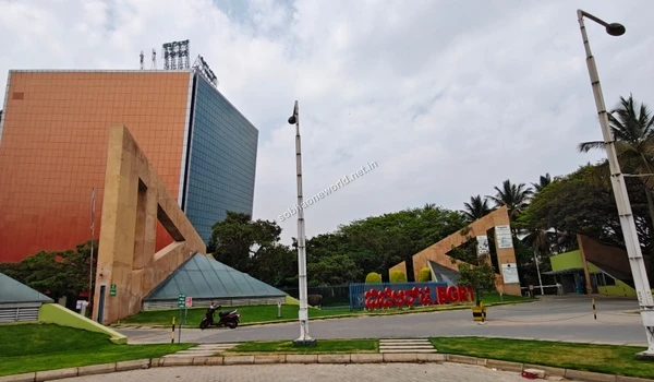 Tall commercial tower with a striking glass facade standing as a prominent landmark in the tech district near Sobha One World