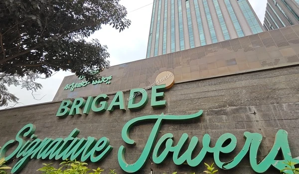Striking corporate architecture rising above the canopy indicating the prime employment opportunities available close to Sobha One World