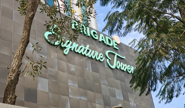 Expansive look at the beautifully maintained business park landscape and imposing commercial towers neighboring Sobha One World