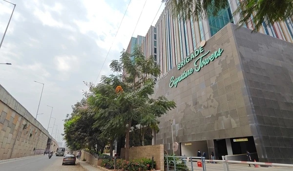 Lush green landscaping surrounding the modern corporate workspaces offering excellent employment hubs for Sobha One World residents