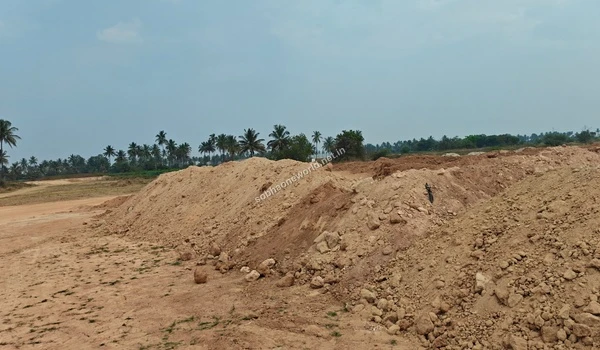 Detailed view of a massive earth berm created from land grading operations at Sobha One World, showcasing the heavy earthmoving involved.