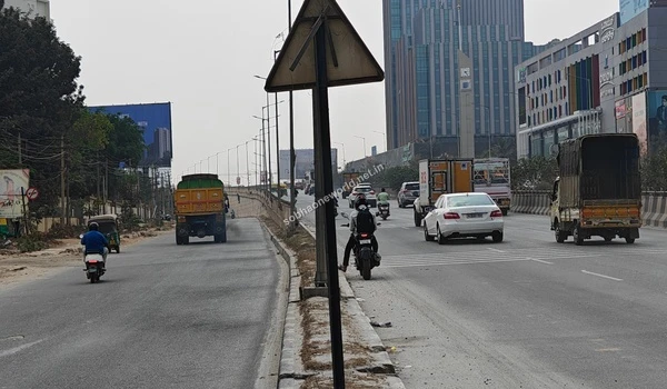 View of the concrete flyover ramp and road infrastructure near the Sobha One World development area
