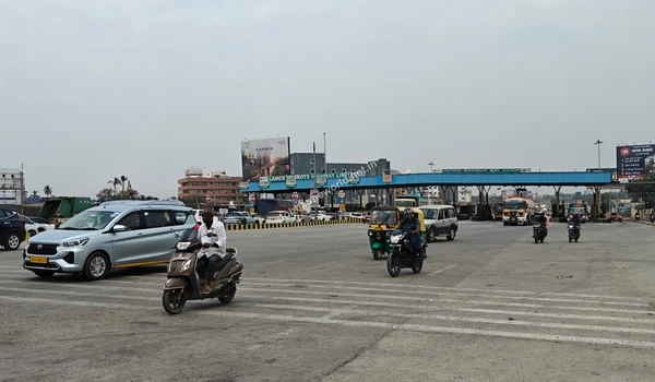 Close-up view of the highway signage leading directly from the toll gate toward Sobha One World