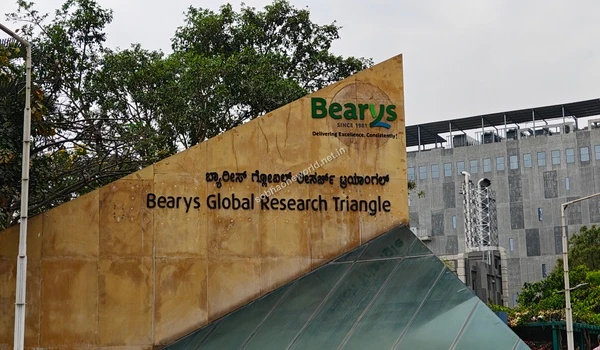 Brightly colored IT hub entrance sign standing out against the landscaped gardens ensuring easy navigation for Sobha One World residents