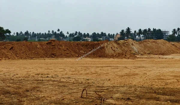 Detailed view of a massive earth berm created from land grading operations at the Sobha One World property, showcasing the heavy earthmoving involved.