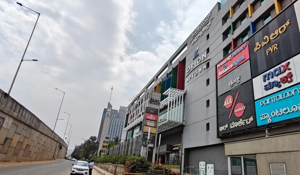 The prominent facade of the entertainment hub featuring dining and cinema options located just a short drive from the Sobha One World residential enclave.