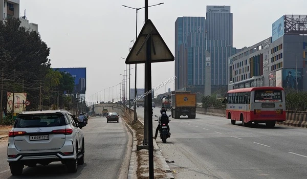 Highway view capturing the nearby Brigade Signature Towers and Orion Avenue along the route to Sobha One World