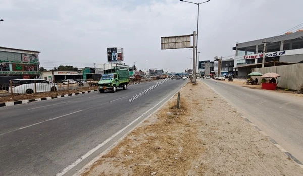 The developing neighborhood streetscape and infrastructure surrounding the Sobha One World location