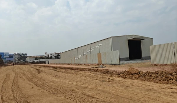 Progress on the temporary site office construction at Sobha One World highlighting the large white shed structure