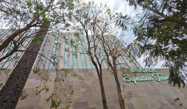 Modern exterior of the business park showcasing the vibrant commercial ecosystem surrounding the Sobha One World property