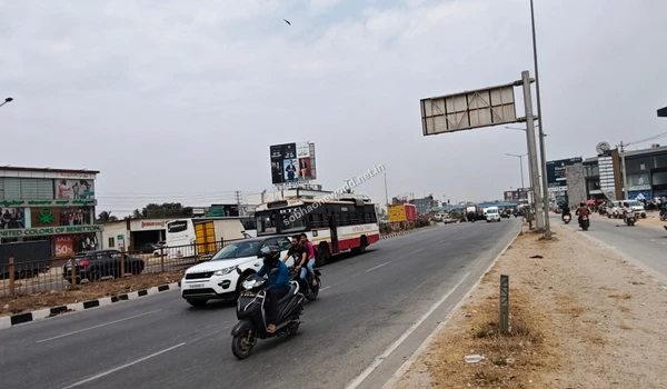 The bustling approach road leading towards the luxurious Sobha One World residential development