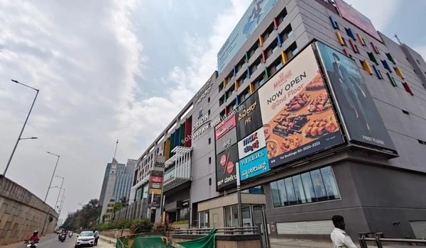 Street-level view of the nearby retail destination providing convenient access to lifestyle brands for Sobha One World residents.