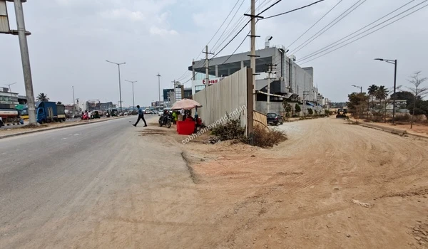 The ongoing development of sidewalks and pedestrian pathways near the immediate entrance of Sobha One World.