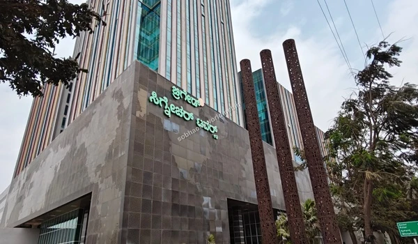 Glass windows of adjacent tech hubs towering into the sky representing the world class commercial infrastructure neighboring Sobha One World