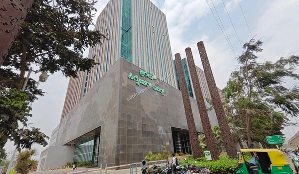 Pedestrians walking past the tech park signage demonstrating the exceptional walk to work convenience for residents of Sobha One World