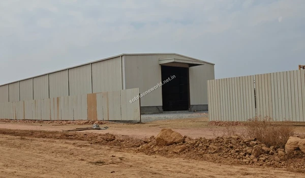 Frontal look at the temporary administrative hub and perimeter fencing built for the Sobha One World project