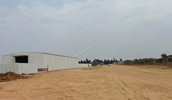 Wide view of the temporary site office construction at the Sobha One World project location showing the surrounding leveled ground