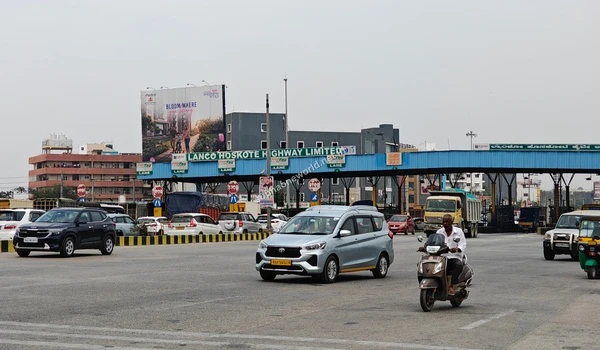 A wide aerial perspective of the Hoskote Toll Plaza showing the rapid commute to Sobha One World