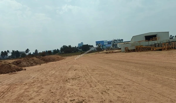 Panoramic view of the vast cleared flatlands at Sobha One World demonstrating the massive scale of land clearing from boundary to boundary.